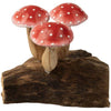 The Small Wooden Red Mushroom Trio features three red mushrooms with white spots and beige stems, closely grouped on a dark brown driftwood base. One mushroom sits at the front with two positioned behind, creating a charming decorative figurine.