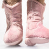 Close-up of two soft, pink Steiff Cowgirl Hoppie Rabbit plush boots with embroidered stars, standing upright on a white surface. Cozy and fuzzy, they offer the softness of a plush stuffed animal for ultimate comfort.