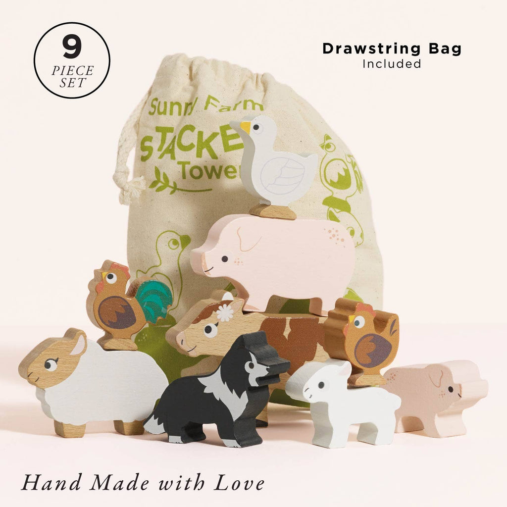 A set of nine wooden Farmyard Stacking Animals arranged in front of a beige drawstring bag. Text reads "9 piece set," "Drawstring bag included," and "Hand Made with Love." A perfect educational gift.