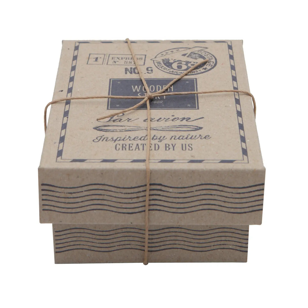 A square cardboard box tied with a twine string, featuring vintage-style printing with the text “Wooden 1930s Car” and wave motifs, presented on a white background.