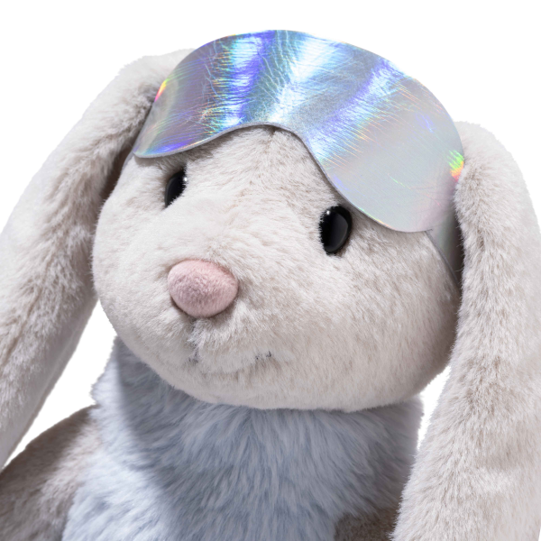 Steiff Hoppie Rabbit, 12 inches tall with light gray fur and floppy ears, wears a colorful ski outfit. The background is plain white.
