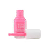 An open bottle of Klee Naturals Deluxe Makeup Kit - Pink Ballet Fairy, featuring bright pink, non-toxic nail polish with a white cap and applicator brush lying in front.