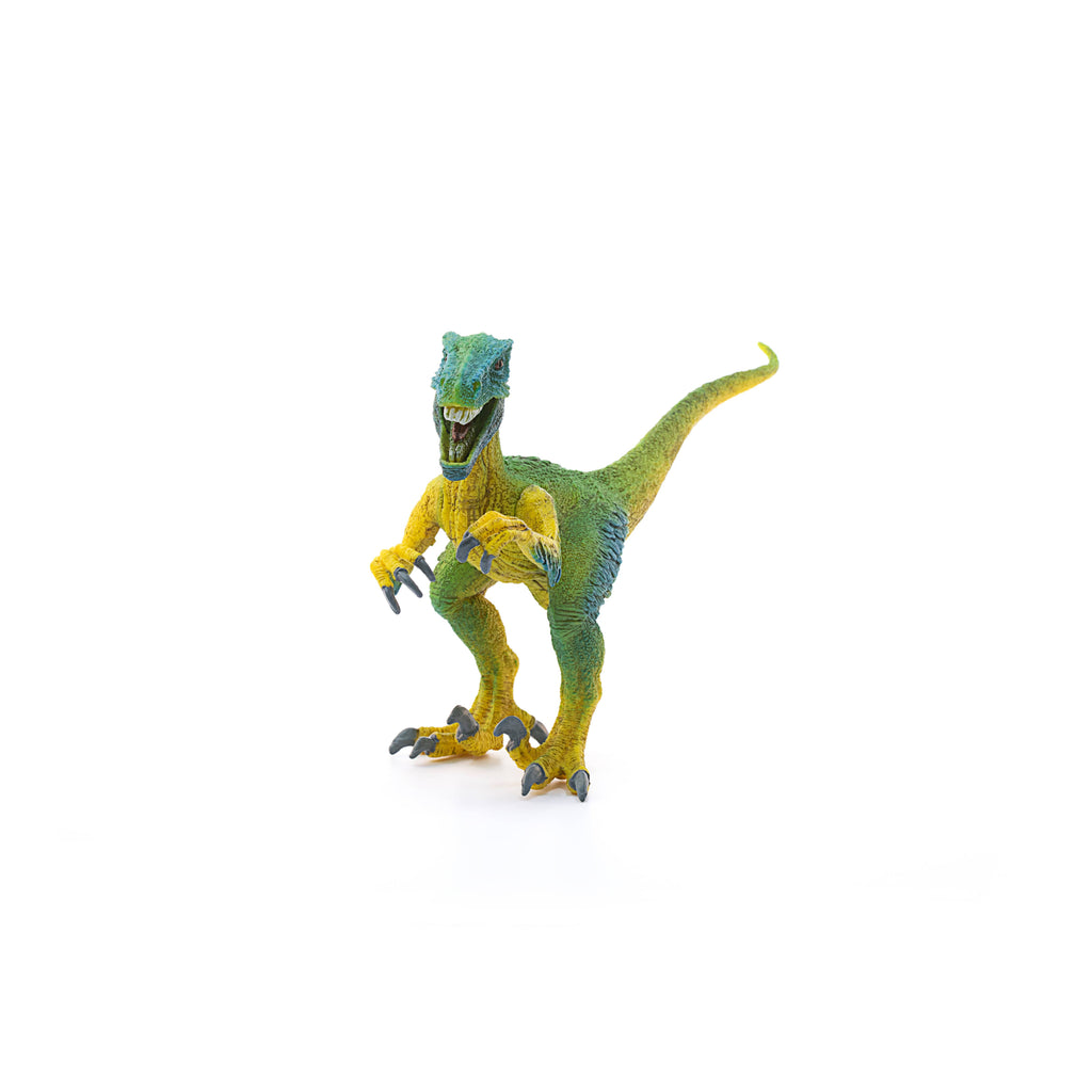The Schleich Velociraptor Dinosaur Toy, featuring a green and yellow design and an upright stance with its mouth open and claws raised, stands on a white background—making it an ideal educational dinosaur figurine for young learners.