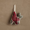 Coral & Tusk Red Cardinal Ornament featuring an embroidered bird perched on a branch with red berries on natural linen, finished with a cream-colored hanging loop.