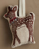 The Coral & Tusk Rudolph Ornament is a small, stuffed reindeer with embroidered brown spots, red nose, and a red collar with silver bells—an adorable addition to your Christmas tree or festive décor.