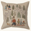 The Coral & Tusk Winter Fun Pillow showcases woodland animals and a small dog in winter attire, skiing and sledding among snowy trees, creating a playful and festive scene ideal for holiday decor.
