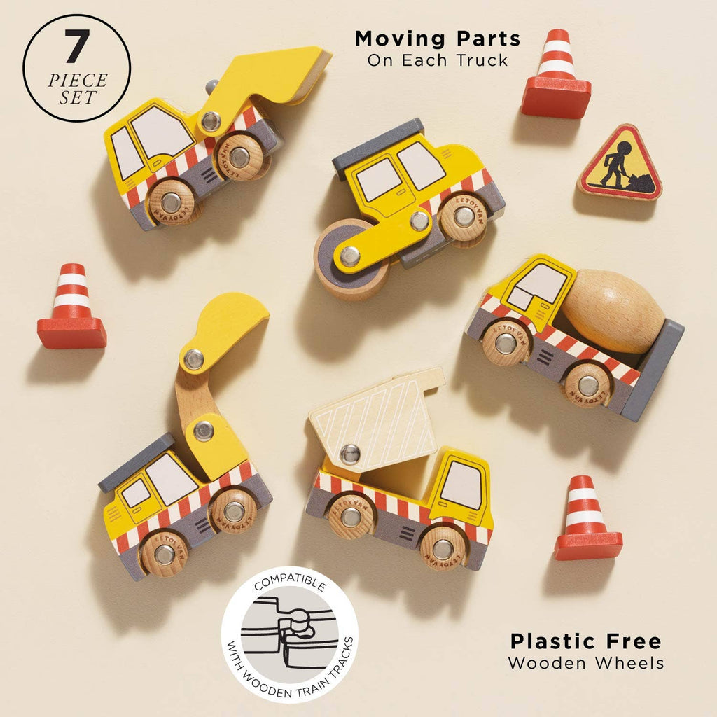 The Construction Toy Cars, Trucks & Diggers set includes 4 yellow wooden vehicles with moving parts, 2 orange cones, and a road sign—perfect for imaginative play and compatible with wooden train tracks. Plastic-free. Ships in one week.