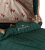 A close-up of the Doll Pram - Bowie Smoke Pine showcases its vintage style with a green quilted organic cotton cover, adorned with the embroidered text "from head to bow." The interior canopy boasts a cream color accented by pink bow patterns.