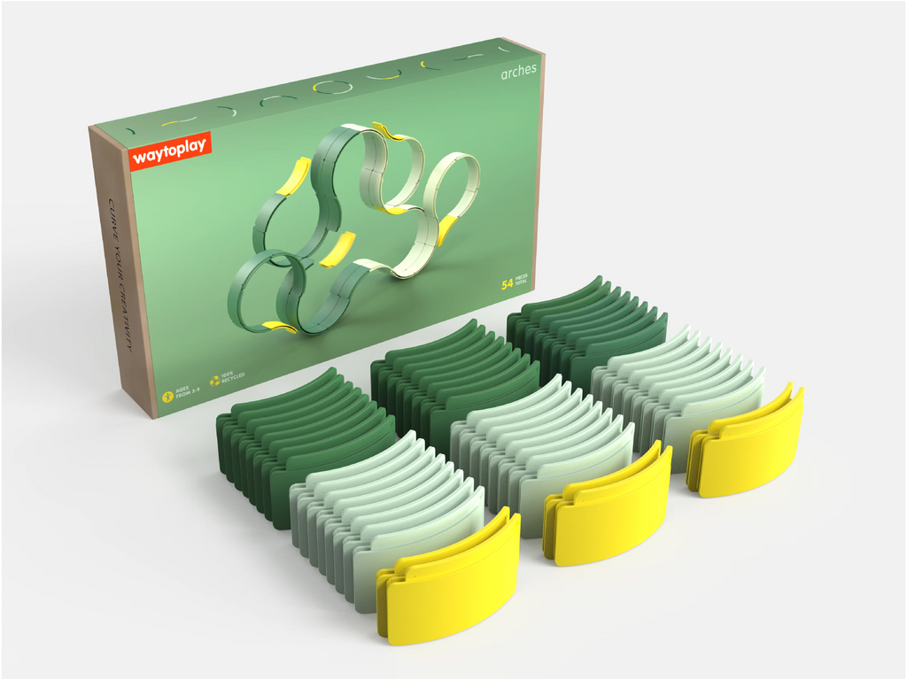 The WaytoPlay: Arches - Builder Set is shown with its box behind three rows of curved plastic track pieces in varying shades of green and yellow, neatly arranged on a white surface—this creative construction toy encourages imaginative play and offers endless building possibilities for children.