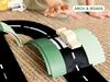 A child’s hand reaches toward a wooden toy car on a curved, modular road track set atop a woven rug—the perfect setting for imaginative play with the WaytoPlay: Arches - Creator Set. “ARCH & ROADS” appears in a green-bordered box in the top right corner.