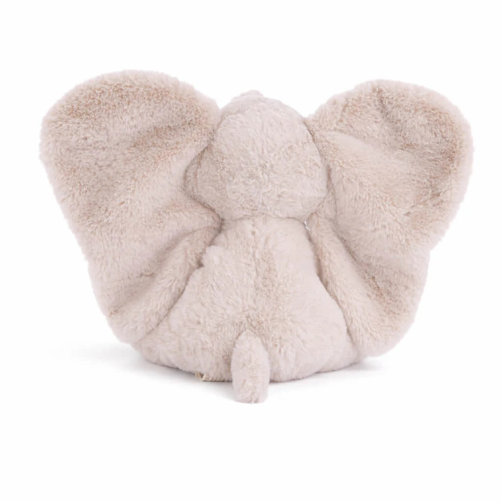 Introducing the Bukowski - August Elephant: a soft, plush toy featuring large floppy ears and a small tail, all crafted in light beige fur. Viewed from behind, this huggable elephant is the perfect bedtime companion for cozy snuggles.