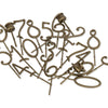A scattered pile of bronze-colored interchangeable numbers (0–9) with pins, displayed on a white background—ideal for customizing your Magical Forest Birthday Train With Beeswax Candles or any birthday train set.
