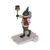 The Magical Forest Birthday Train With Beeswax Candles features a whimsical frog figurine in a wizard hat, striped shirt, and vest, standing on wheels while holding a staff topped with a cup.