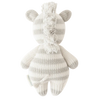 A hand-knit Cuddle + Kind Baby Zebra toy in a white and light grey color scheme, viewed from the back, featuring distinct striped patterns and a fluffy mane.