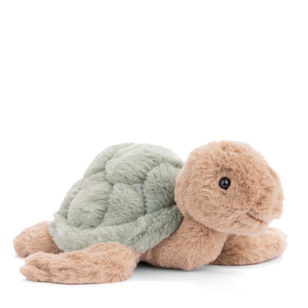 The Bukowski Baby Sandy Sea Turtle - Green is a soft plush toy with a light brown head, legs, and tail, a pale green textured shell, black button eyes, and is shown on a white background.