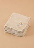 A set of Konges Sloejd Organic Cotton Baby Cloths (6 Pack) is neatly folded, with the top beige cloth adorned with a charming embroidered yellow duck holding a red heart on a blue branch. Arranged on a plain, light brown surface, these nursery cloths are perfect for any gentle care routine.