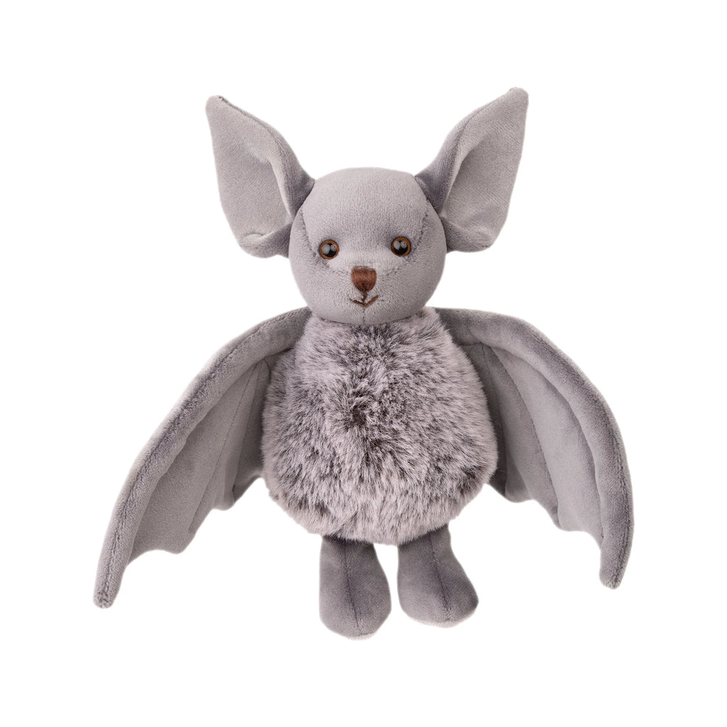 The Bukowski - Baltazar Bat is a plush soft toy featuring large ears, round eyes, a furry body, and outstretched wings, standing upright against a white background.