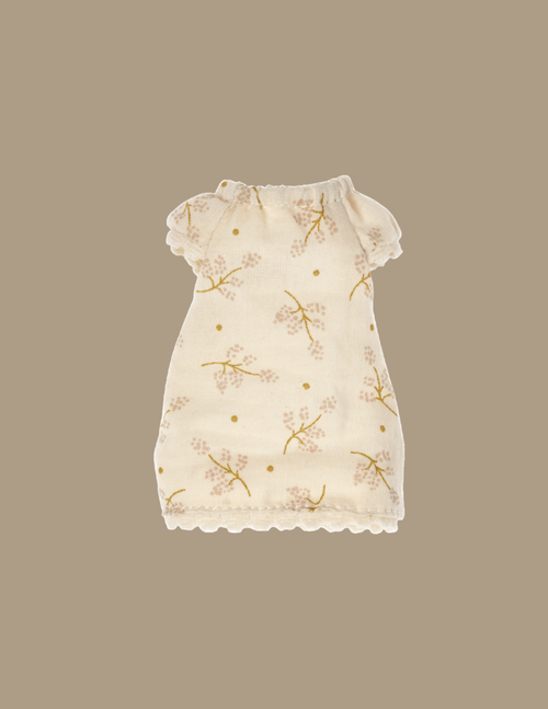 Maileg Extra Clothing: Nightgown For Big Sister Mouse is cream-colored with delicate floral patterns in light brown and yellow, perfect for a pyjamas party. The nightgown features short sleeves, a gathered neckline, and scalloped hems at the bottom. The background is a soft beige tone.