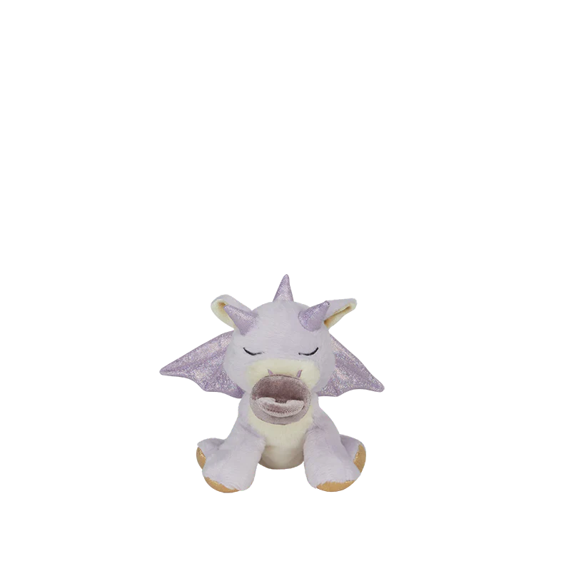 The Olli Ella Binky Dragon - Misty - Lavender is a small plush toy with light purple wings, a unicorn-like horn, closed eyes, and gold-accented feet, sitting against a plain white background.