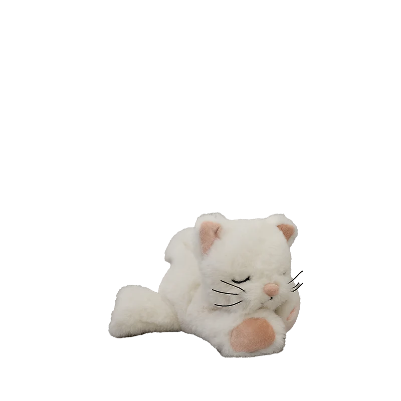 The Olli Ella Binky Kitten Kiki - White is a cuddly plush lying down with closed eyes, one paw raised to its face, pink accents on its nose, ears, and paw, black whiskers, and set against a plain white background.