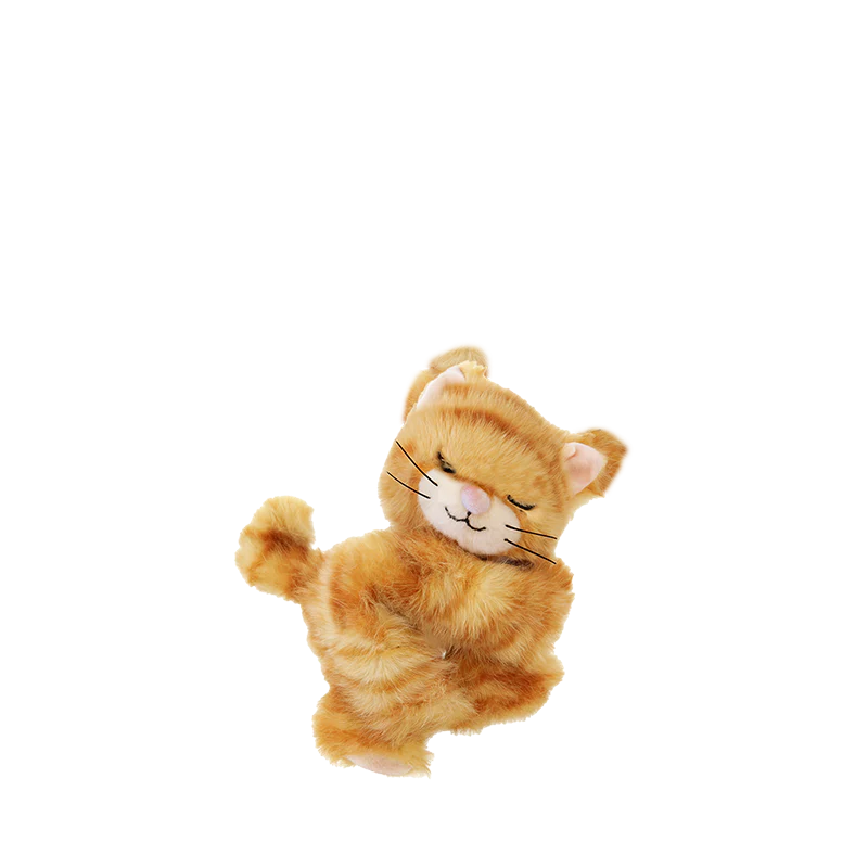 The Olli Ella Binky Kitten Koda - Ginger is a plush kitten with orange and white fur, smiling with closed eyes and a curled tail—an adorable cuddly stuffed animal for all ages.