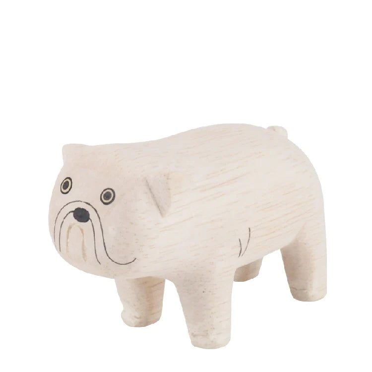 A hand-carved wooden figurine of a Handmade Tiny Wooden Bulldog with a simplistic design isolated on a white background. The figurine features prominent painted eyes and a detailed snout.
