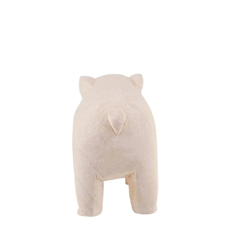 A minimalistic, beige-colored hand-carved wooden sculpture of a Tiny Wooden Bulldog seen from the back, featuring a rounded body and subtle details for the head and legs, set against a plain white background.