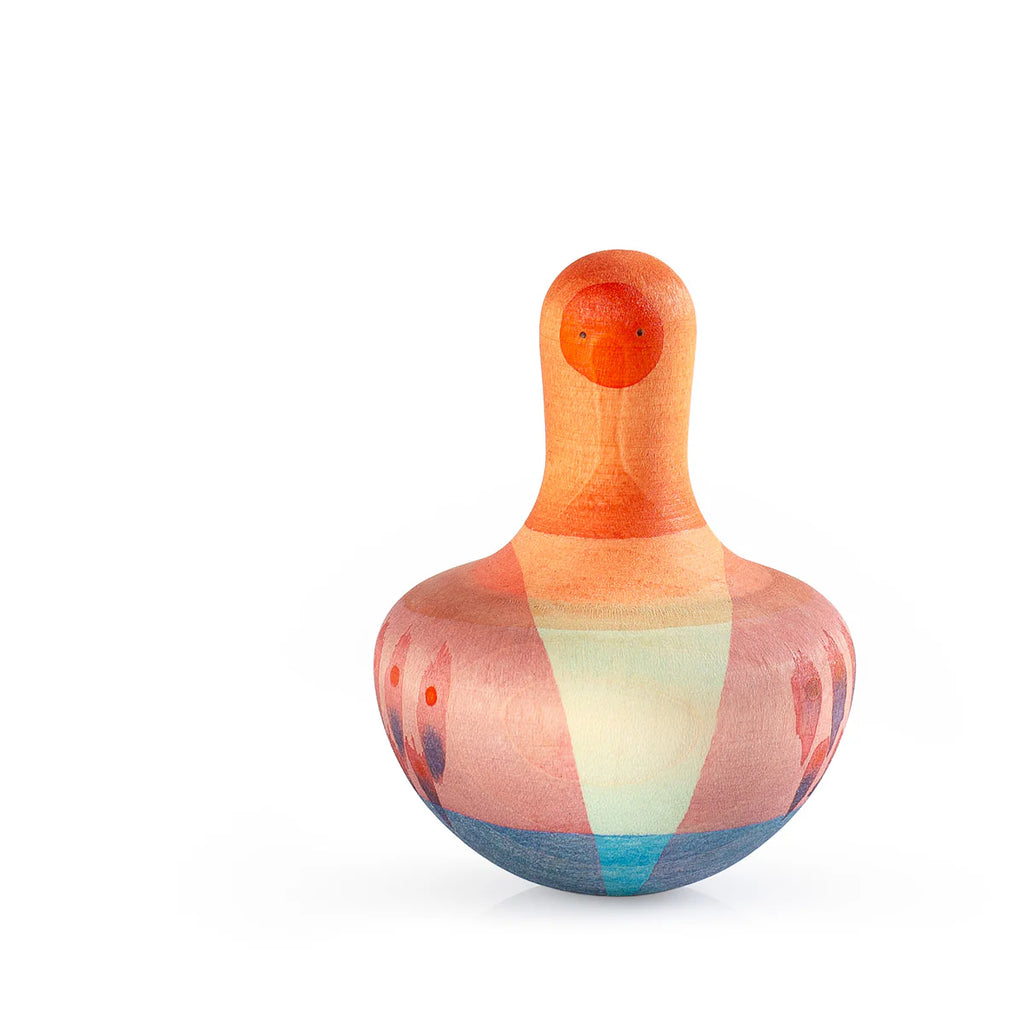 The Grapat Mellow Orange Bird Rocking Toy features a colorful, bird-like shape with vibrant orange, blue, and pink gradient feathers on its smooth surface. It has a small spherical head on top against a white background. Ships in about one week.