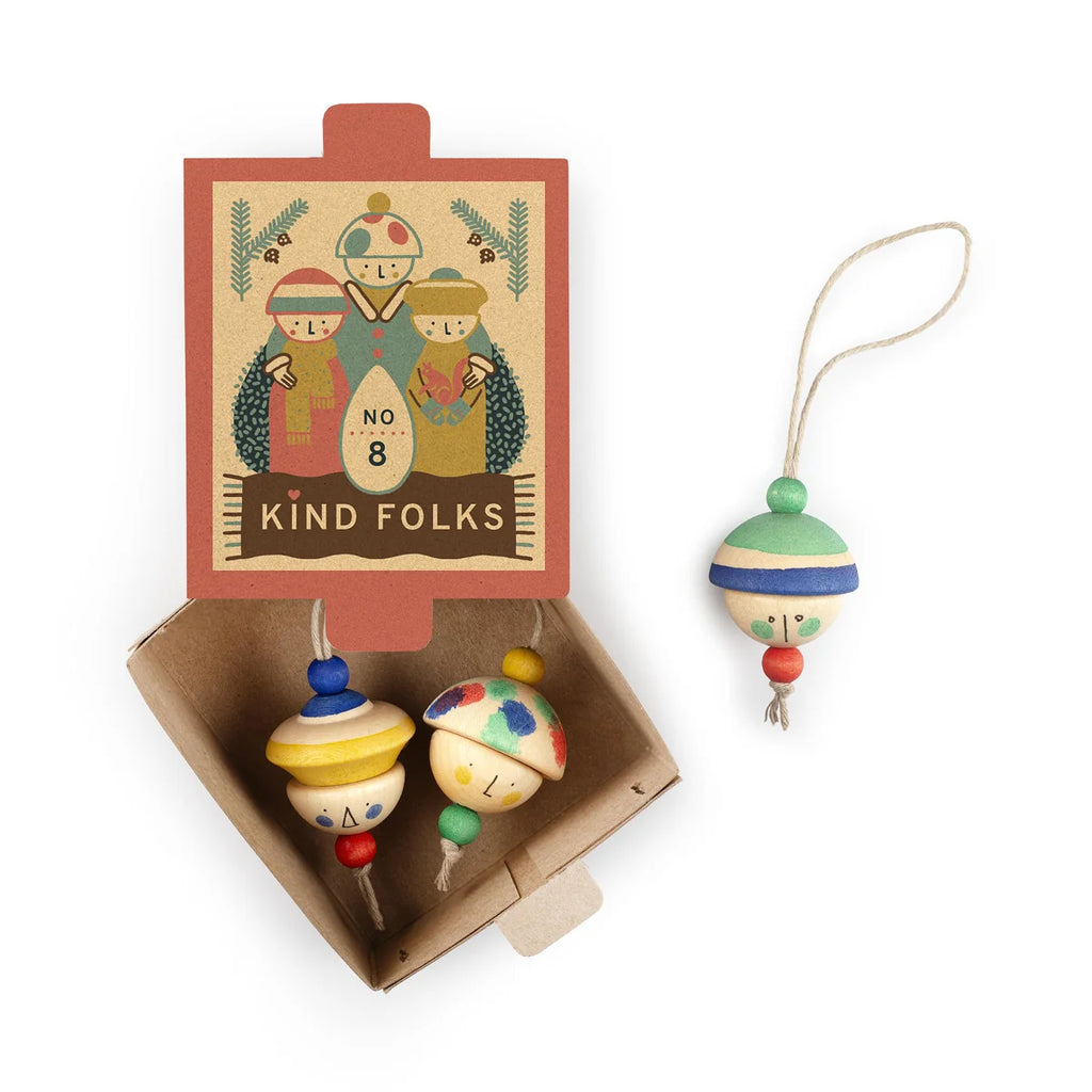 The Grapat Ornament Set - No 8 - Kind Folks includes two hand-painted wooden ornaments with festive hats and a matching hanging Christmas ornament in an open box.