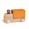 The Lubulona Wooden Truck - Ochre features natural wood wheels and cab, an orange rectangular cargo bed, and a small round brown wooden driver with a blue base—ideal for eco-friendly toy collections.