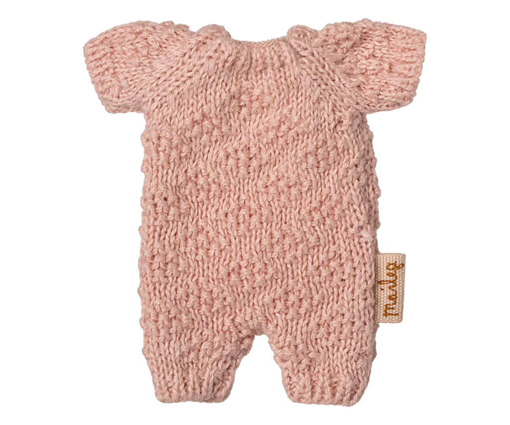 The Maileg Springtime Wardrobe Set features a pink knitted baby romper with short sleeves, textured pattern, and side brown tag—ideal for playtime near your Maileg mouse closet or vintage floor lamp.