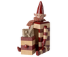 The PRE-ORDER: Maileg Elf with Drawer - Red features a smiling, blocky elf in red-and-beige stripes with a pointed hat and scarf, sitting beside a matching ribbon-tied gift box. Estimated arrival is mid August.