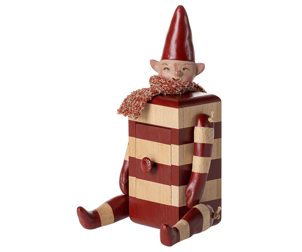Add charm to any space with the PRE-ORDER: Maileg Elf with Drawer - Red. This collectible elf features a red hat, scarf, striped body, pointed ears, and outstretched arms and legs. Estimated arrival is mid August.