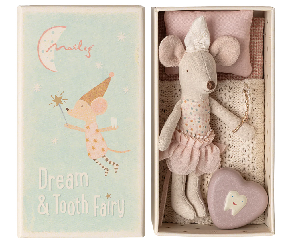 The Maileg Tooth Fairy Mouse, Little Sister, dressed as a tooth fairy, lies in a matchbox bed next to a purple heart-shaped tooth box with an illustrated mouse fairy and "Dream & Tooth Fairy" on the lid.