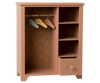 The Maileg Wardrobe, Large - Dark Powder features a pink wooden design with floral backing, three pastel hangers for doll clothes, four right-side shelves, and an open bottom drawer—ideal for organizing a child's room.