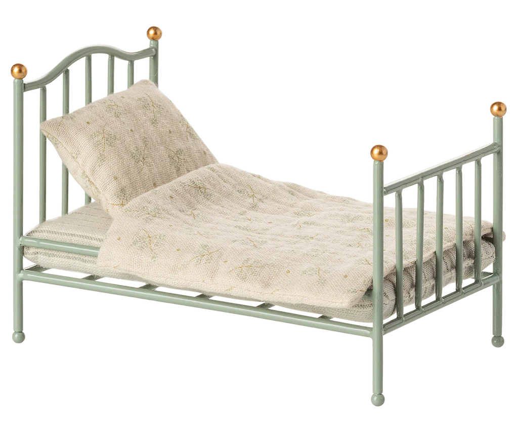 The Maileg Vintage Single Bed, Mouse - Mint features a pale green finish with gold-trimmed bedposts and cream floral bedding—ideal as a charming mice bed.