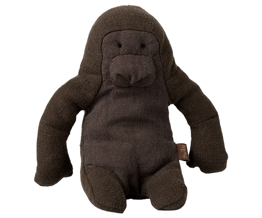 The Maileg Gorilla, Mini is a dark brown plush toy shaped like a gorilla, made of soft fabric with stitched facial features and a small side tag—perfect for Safari friends collections.