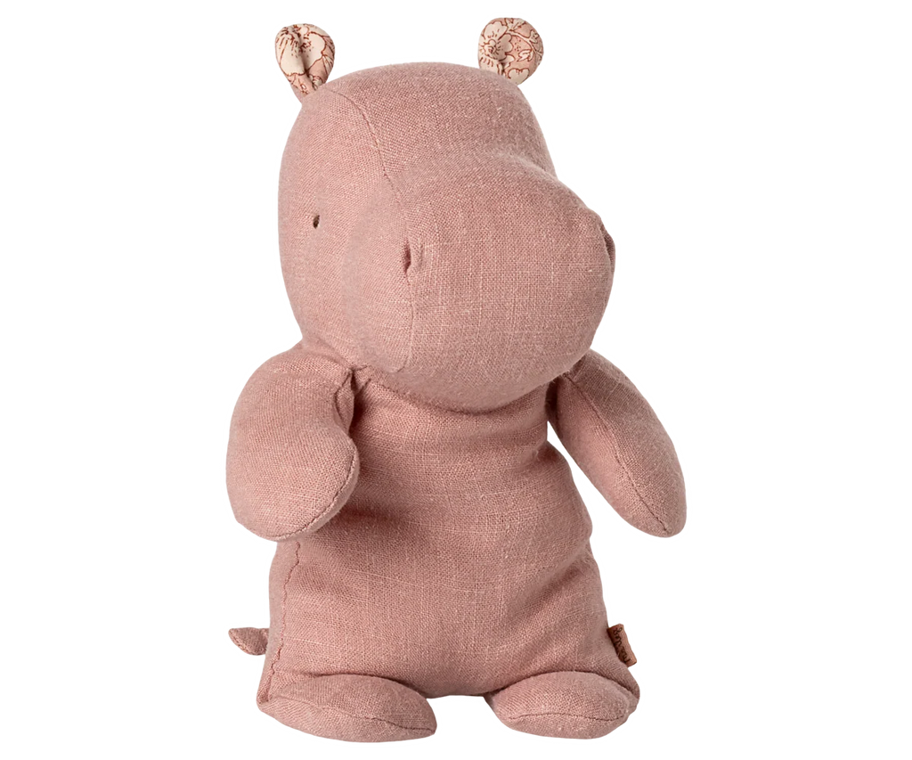 Maileg Hippo, Small - Rose is a soft, light brown stuffed hippopotamus toy crafted from gentle fabric, featuring small floral-patterned inner ears and posed sitting upright against a plain white background—a charming addition to any Safari friends collection.