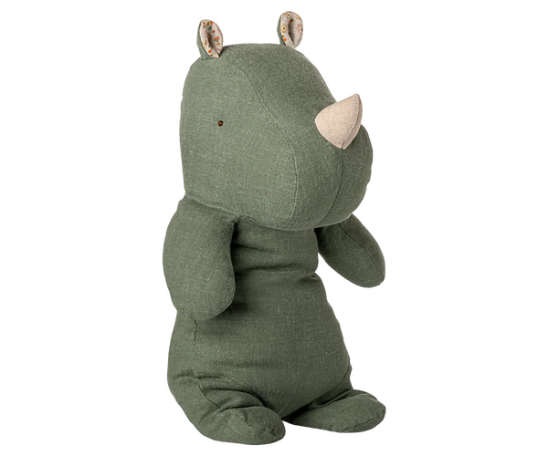 The Maileg Rhino, Medium - Sage is a plush toy in green with soft fabric, a beige horn, small button eyes, and patterned inner ears, shown sitting upright against a plain white background.