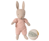 The Maileg Rabbit With Accessories, Micro - Sand - Rose stands beside a pastel fabric ball labeled "Maileg," both set against a plain white background. The rabbit wears a pink knitted outfit, making it a charming storytelling toy.
