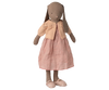 A brown fabric bunny doll stands upright against a white background, dressed in a pink dress with matching shoes and wearing the Maileg Knitted Cardigan, Size 4 - Light Rose (expected 02/15/26).