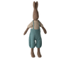 The Maileg Rabbit, Size 3 - Brown, wears a knitted shirt and overall, and stands upright against a plain white background.
