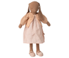 A stuffed brown bunny doll stands upright against a white background, dressed in adorable bunny clothes—a pale pink dress, matching pink slippers, and the Maileg Knitted Cardigan, Size 3 - Light Rose (expected 02/15/26).