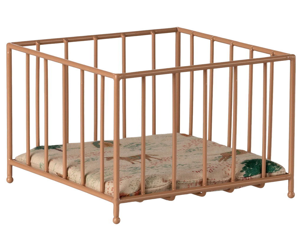 The Maileg Playpen, Micro - Dark powder is a small, square metal playpen with vertical bars and comes with a patterned cushion.