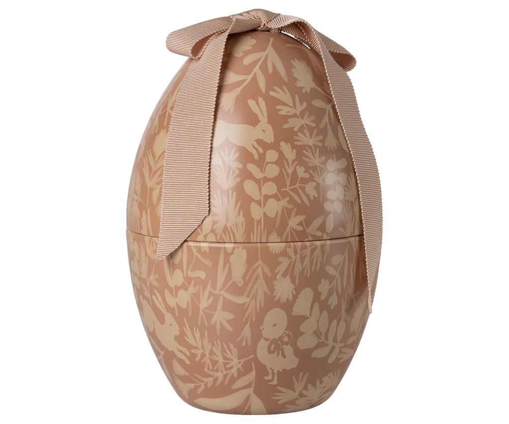 The Maileg Easter Egg, Medium - Powder features a light brown floral and animal pattern with a striped ribbon bow—an enchanting decorative egg for your spring display.