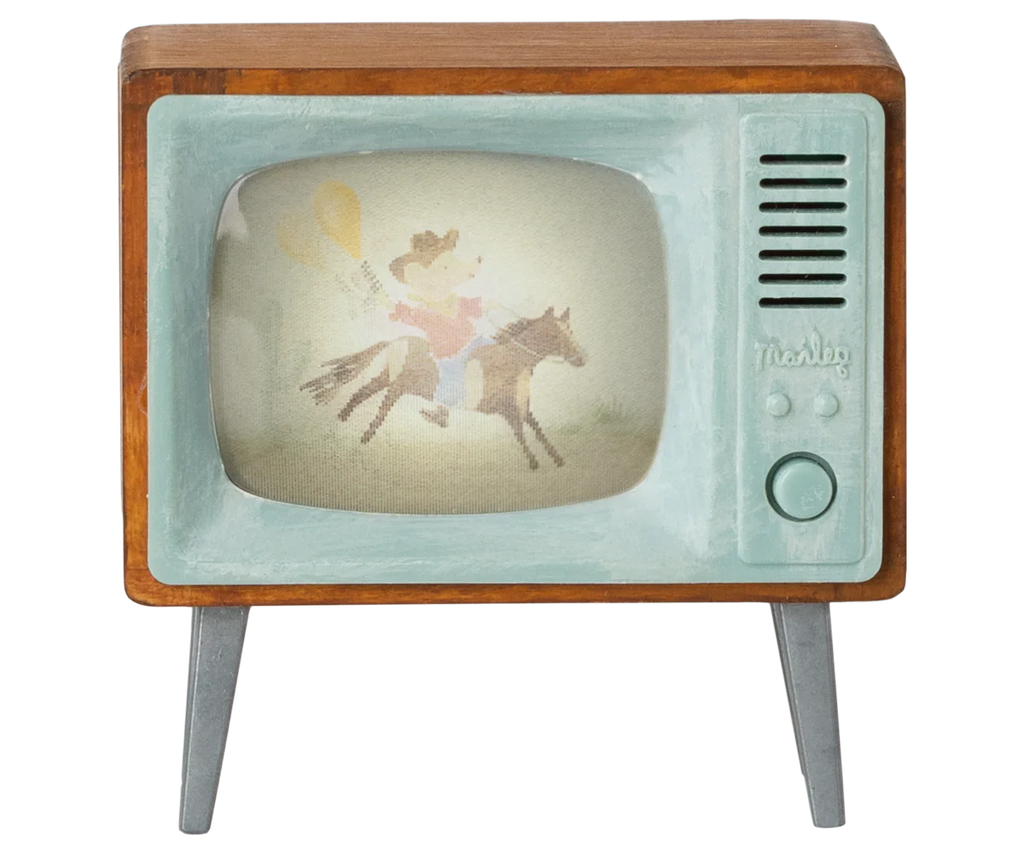 The Maileg Television, Mouse (expected 03/15/26) features vintage wooden sides, angled legs, a blue retro front with a large dial, and displays a faded cowboy image—perfect as miniature home decor.