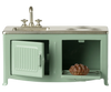 The Maileg Kitchen, Mouse - Mint (expected 02/15/26) is a miniature green kitchen set with a metal sink, faucet, stove burners, and an oven door that opens to reveal a tiny pie inside.