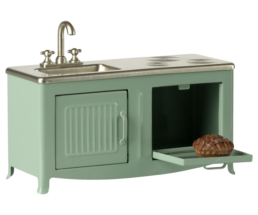 The Maileg Kitchen, Mouse - Mint (arriving 02/15/26) is a small mint green metal playset with a sink, faucet, stovetop, oven, and mini loaf of bread—ideal for imaginative mouse family cooking adventures.