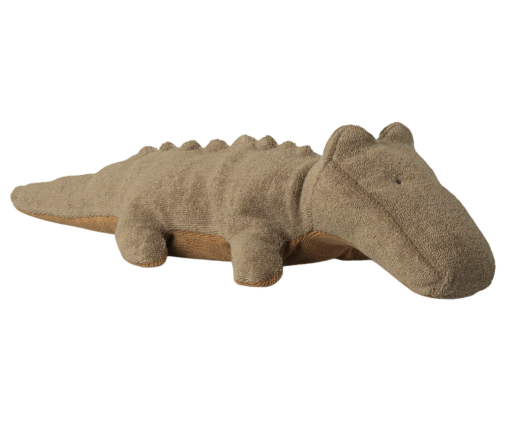 The Maileg Crocodile, Small—an olive green plush toy with stitched features, small back bumps, and four short legs—is expected to arrive by 06/15/26.