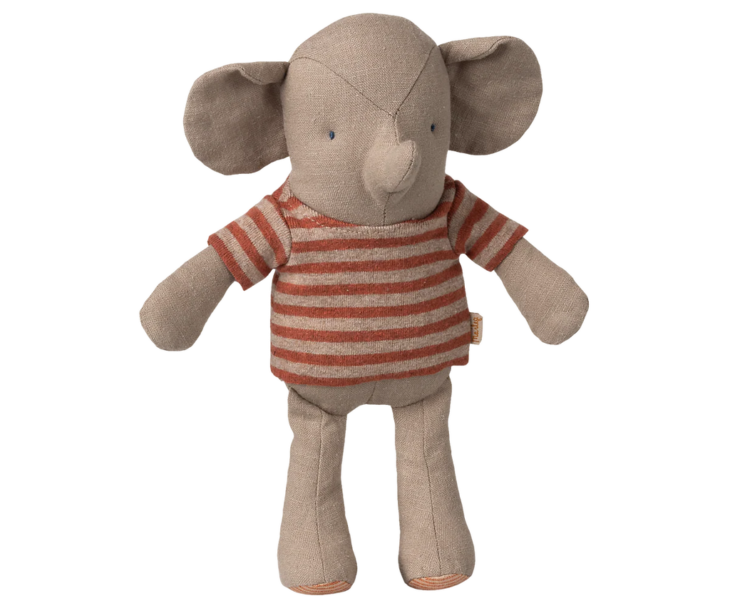 Maileg Little Jumbo the Elephant is a small linen stuffed animal with large ears, stitched eyes, soft light-brown limbs, and a red-and-beige striped shirt, shown standing upright against a white background. Expected arrival: 06/01/26.